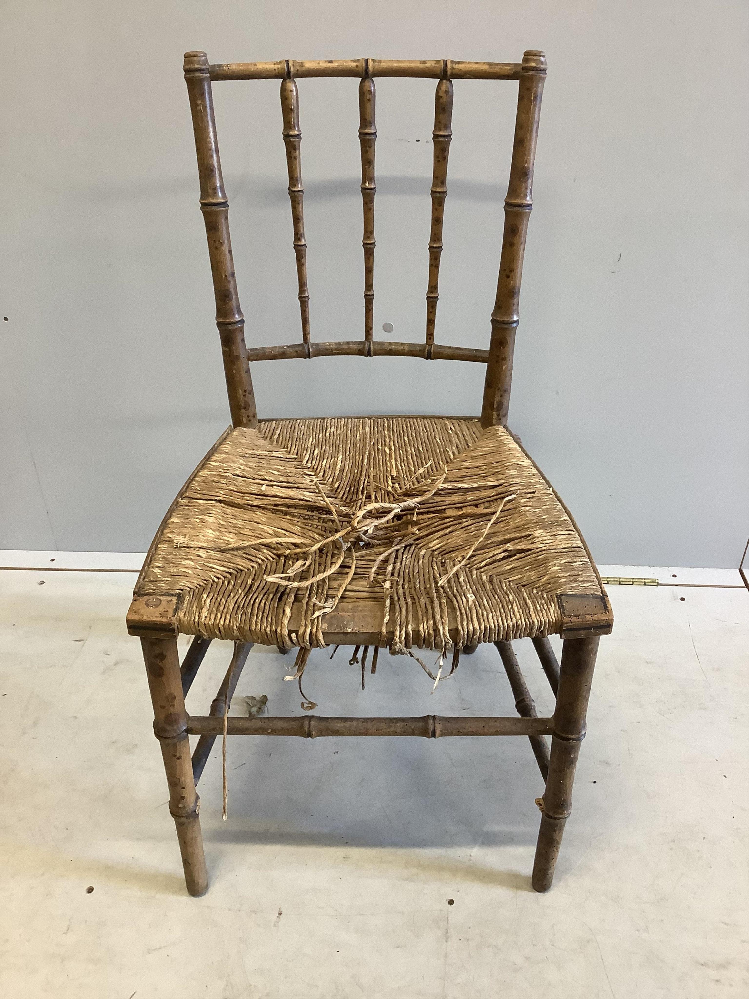 A pair of 19th century faux bamboo rush seat chairs, width 47cm, depth 40cm, height 87cm. Condition - poor